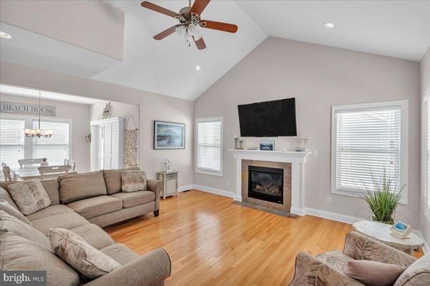 Chandelier, Dining room, Fireplace, Interior, Living room, Recessed Lighting, Wood Texture Flooring