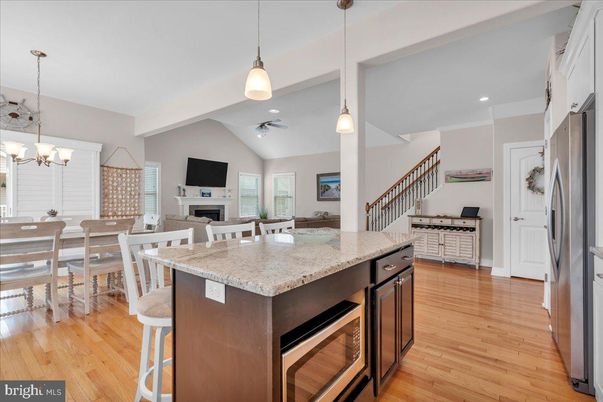 Chandelier, Dining room, Fireplace, Interior, Kitchen, Pendant Lights, Recessed Lighting, Wood Texture Flooring