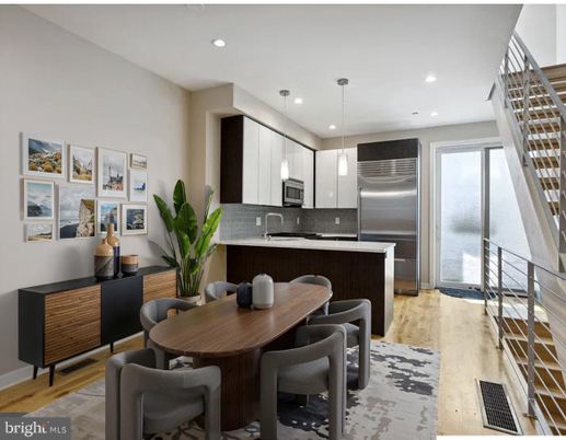 Dining room, Interior, Kitchen, Pendant Lights, Recessed Lighting, Stainless Steel Appliances, Wood Texture Flooring