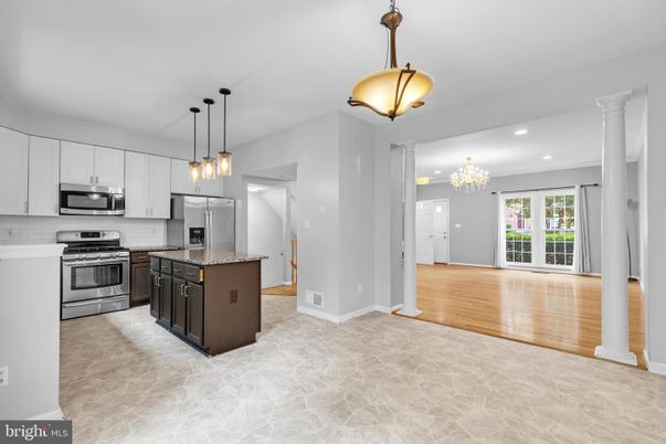 Chandelier, Interior, Kitchen, Pendant Lights, Recessed Lighting, Stainless Steel Appliances, Wood Texture Flooring