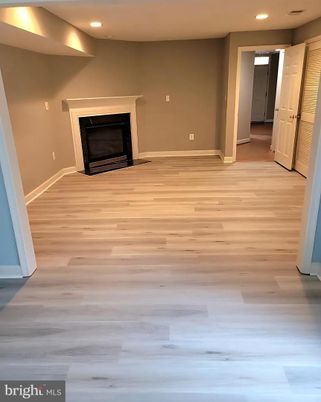 Empty room, Fireplace, Interior, Recessed Lighting, Wood Texture Flooring