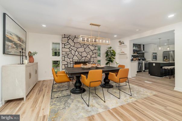 Dining room, Fireplace, Interior, Kitchen, Pendant Lights, Recessed Lighting, Stainless Steel Appliances, Stone Walls, Wood Texture Flooring