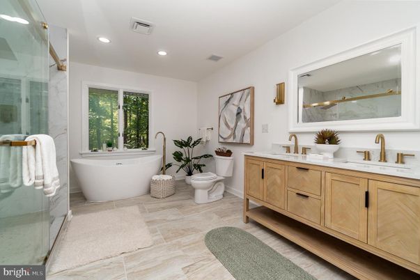 Bathroom, Dual Sink Vanities, Free Standing Baths, Glass Shower, Interior, Marble Walls, Recessed Lighting