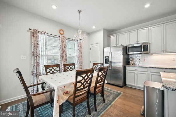 Chandelier, Dining room, Interior, Kitchen, Pendant Lights, Recessed Lighting, Stainless Steel Appliances, Wood Texture Flooring