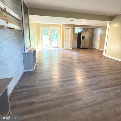 Empty room, Fireplace, Interior, Recessed Lighting, Stone Walls, Wood Texture Flooring