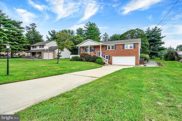 Attached, Backyard, Exterior, Facade, Brick Facade, Split Level