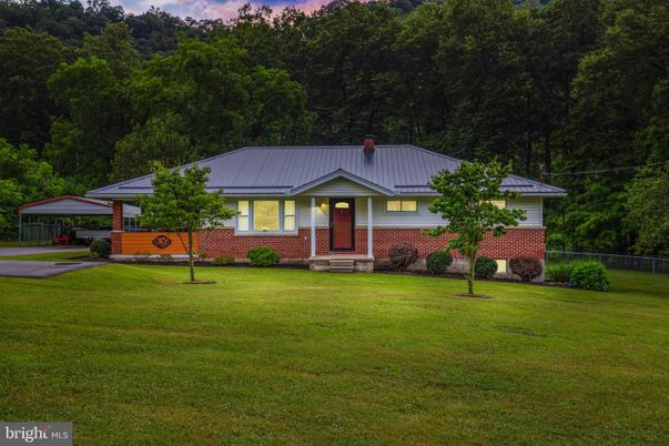 Attached, Backyard, Exterior, Facade, Brick Facade, Solar Panels, None