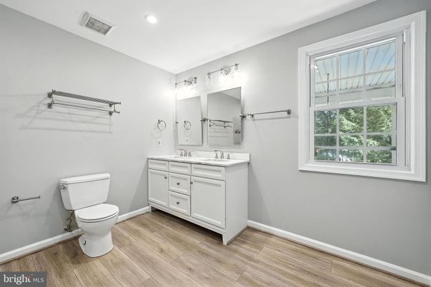 Bathroom, Dual Sink Vanities, Interior, Recessed Lighting, Wood Texture Flooring
