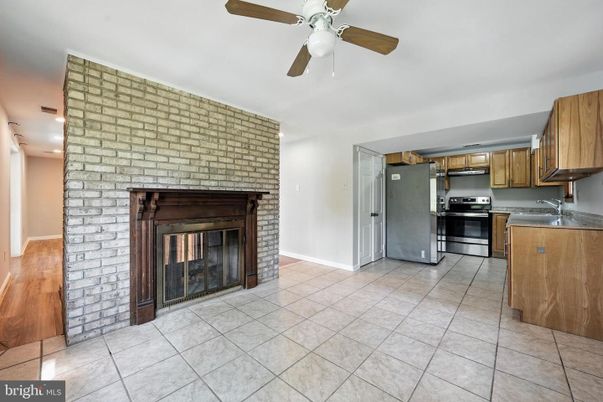 Fireplace, Interior, Kitchen, Stainless Steel Appliances, Stone Walls