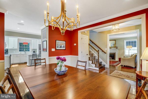 Chandelier, Dining room, Fireplace, Interior, Kitchen, Recessed Lighting, Wood Texture Flooring