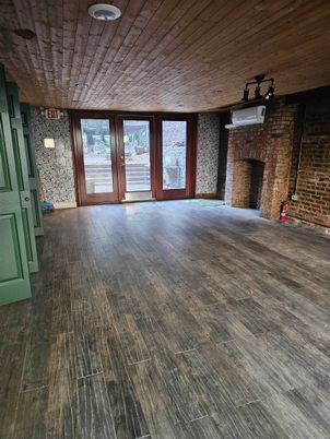 Empty room, Fireplace, Interior, Stone Walls, Wooden Ceilings, Wood Texture Flooring