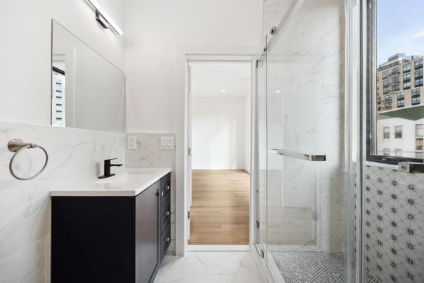 Bathroom, Glass Shower, Interior, Marble, Marble Walls, Recessed Lighting, Wood Texture Flooring