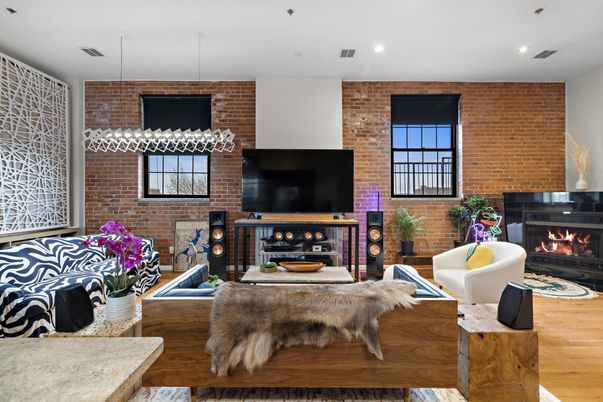 Fireplace, Interior, Living room, Recessed Lighting, Stone Walls, Wood Texture Flooring