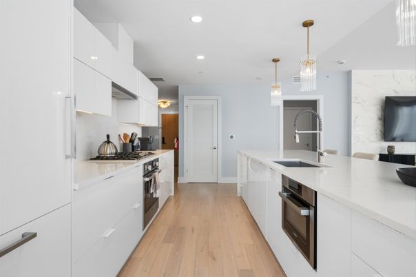 Interior, Kitchen, Marble Walls, Pendant Lights, Recessed Lighting, Stainless Steel Appliances, Wood Texture Flooring