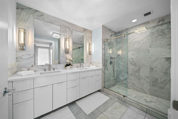 Bathroom, Dual Sink Vanities, Glass Shower, Interior, Marble, Marble Walls, Recessed Lighting