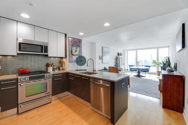Dining room, Interior, Kitchen, Living room, Recessed Lighting, Stainless Steel Appliances, Wood Texture Flooring