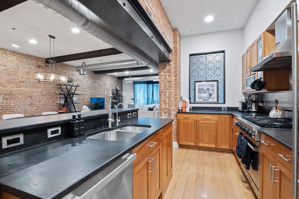 Interior, Kitchen, Pendant Lights, Recessed Lighting, Stainless Steel Appliances, Stone Walls, Wood Texture Flooring