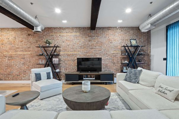Fitness Equipment, Interior, Living room, Recessed Lighting, Stone Walls, Wood Texture Flooring
