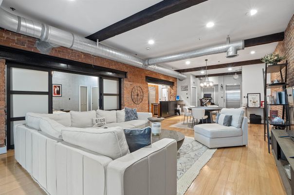 Dining room, Interior, Kitchen, Living room, Pendant Lights, Recessed Lighting, Stainless Steel Appliances, Stone Walls, Wooden Beams, Wood Texture Flooring