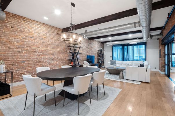 Chandelier, Dining room, Interior, Living room, Pendant Lights, Recessed Lighting, Stone Walls, Wooden Beams, Wood Texture Flooring