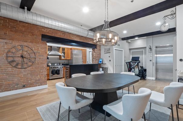 Chandelier, Dining room, Interior, Kitchen, Pendant Lights, Recessed Lighting, Stainless Steel Appliances, Stone Walls, Wood Texture Flooring