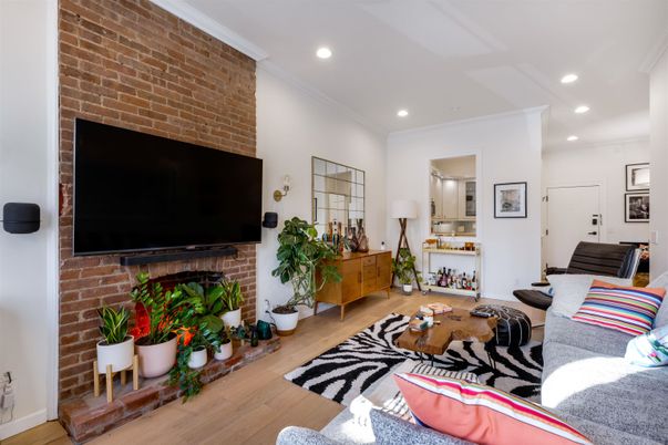 Fireplace, Interior, Living room, Recessed Lighting, Stone Walls, Wood Texture Flooring