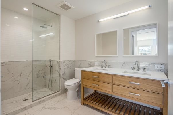 Bathroom, Dual Sink Vanities, Glass Shower, Interior, Marble, Marble Walls, Recessed Lighting