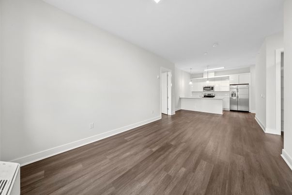 Empty room, Interior, Kitchen, Pendant Lights, Stainless Steel Appliances, Wood Texture Flooring