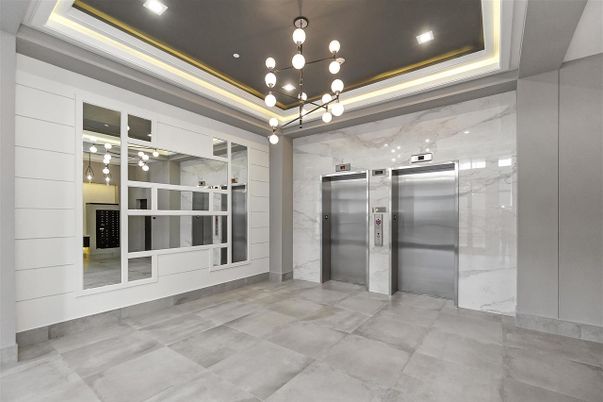 Elevator, Interior, Marble Walls, Pendant Lights, Recessed Lighting