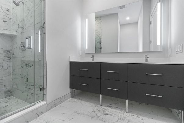 Bathroom, Dual Sink Vanities, Glass Shower, Interior, Marble, Marble Walls, Recessed Lighting