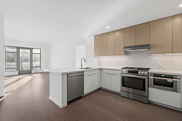 Interior, Kitchen, Marble Walls, Recessed Lighting, Stainless Steel Appliances, Wood Texture Flooring