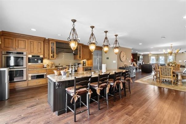 Chandelier, Dining room, Interior, Kitchen, Pendant Lights, Recessed Lighting, Stainless Steel Appliances, Wood Texture Flooring
