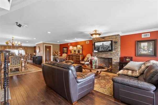 Chandelier, Dining room, Fireplace, Interior, Living room, Recessed Lighting, Stone Walls, Wood Texture Flooring