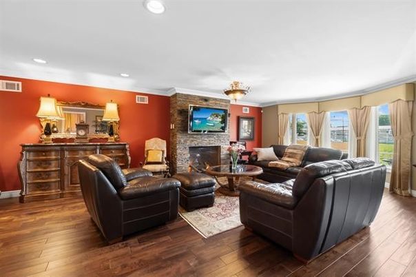 Fireplace, Interior, Living room, Recessed Lighting, Stone Walls, Wood Texture Flooring