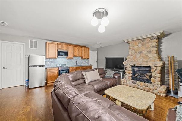Fireplace, Interior, Kitchen, Living room, Stainless Steel Appliances, Stone Walls, Wood Texture Flooring