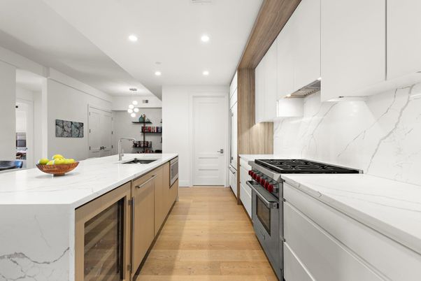 Interior, Kitchen, Marble Walls, Pendant Lights, Recessed Lighting, Stainless Steel Appliances, Wood Texture Flooring