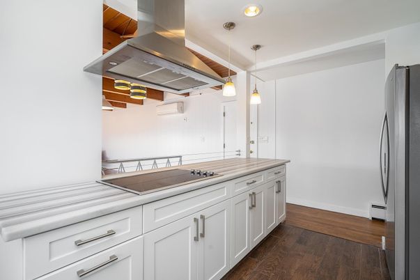Interior, Kitchen, Pendant Lights, Recessed Lighting, Stainless Steel Appliances, Tile Countertops, Wood Texture Flooring