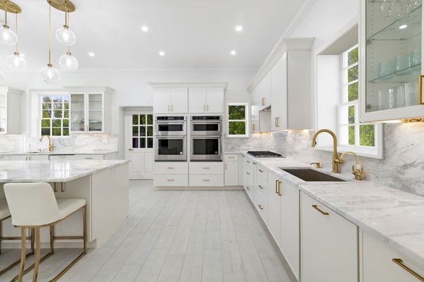 Interior, Kitchen, Marble Walls, Pendant Lights, Recessed Lighting, Stainless Steel Appliances, Wood Texture Flooring