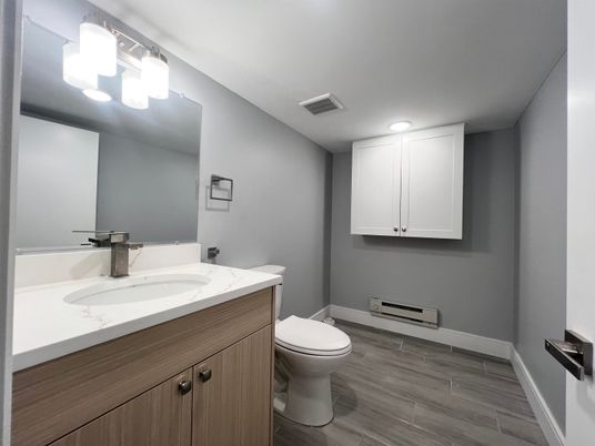 Bathroom, Dual Sink Vanities, Interior, Recessed Lighting, Wood Texture Flooring