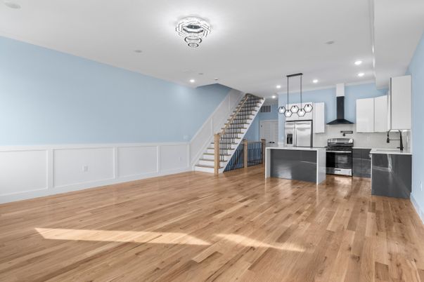 Empty room, Interior, Kitchen, Pendant Lights, Recessed Lighting, Stainless Steel Appliances, Wood Texture Flooring