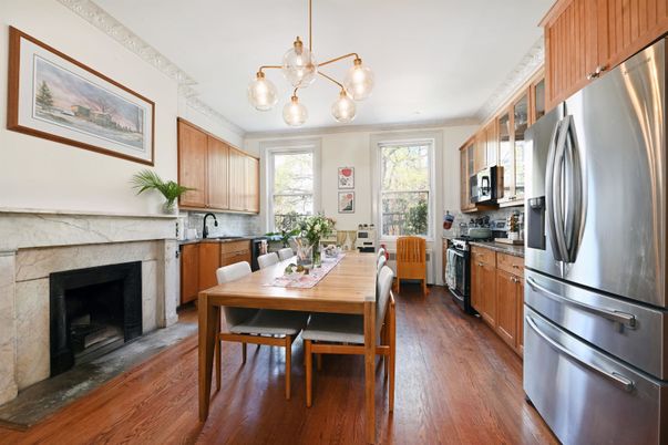Dining room, Fireplace, Interior, Kitchen, Pendant Lights, Stainless Steel Appliances, Wood Texture Flooring