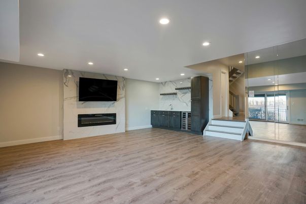 Empty room, Fireplace, Interior, Marble Walls, Recessed Lighting, Wood Texture Flooring