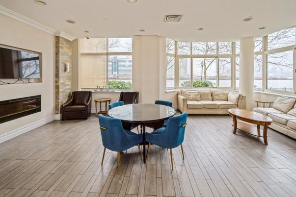 Dining room, Fireplace, Interior, Living room, Recessed Lighting, Water, Wood Texture Flooring