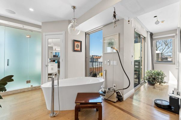 Bathroom, Free Standing Baths, Interior, Pendant Lights, Recessed Lighting, Wood Texture Flooring