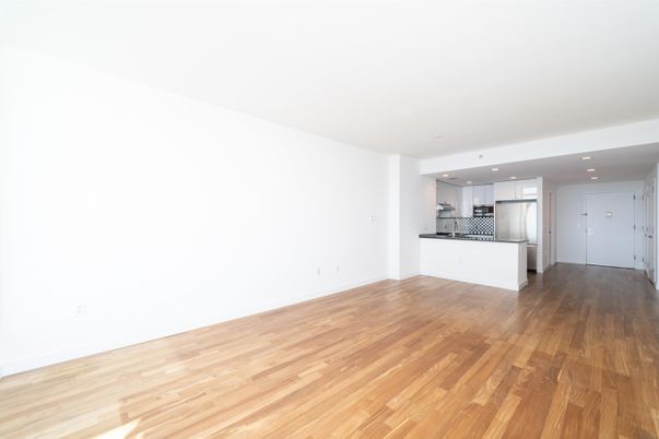Empty room, Interior, Kitchen, Recessed Lighting, Stainless Steel Appliances, Wood Texture Flooring