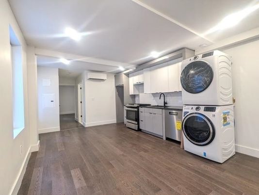 Interior, Kitchen, Recessed Lighting, Washer, Wood Texture Flooring