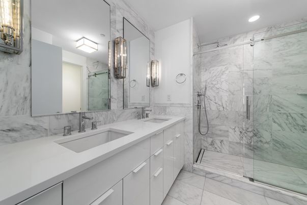 Bathroom, Dual Sink Vanities, Glass Shower, Interior, Marble, Marble Walls, Recessed Lighting