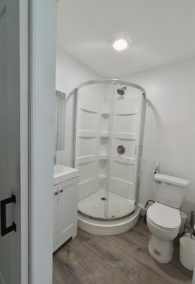 Bathroom, Glass Shower, Interior, Recessed Lighting, Wood Texture Flooring