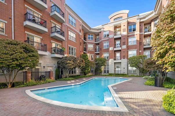 Exterior, Facade, Brick Facade, Pool, Condo Building