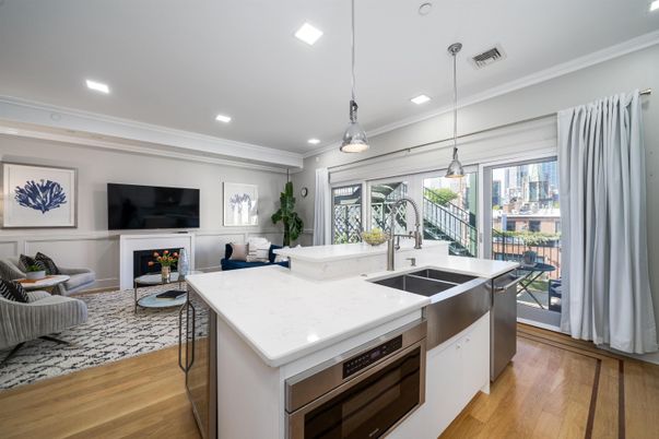Fireplace, Interior, Kitchen, Living room, Pendant Lights, Recessed Lighting, Stainless Steel Appliances, Wood Texture Flooring